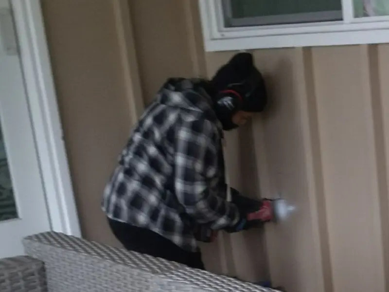 Professional electrician installing an exterior outlet in Greenburgh